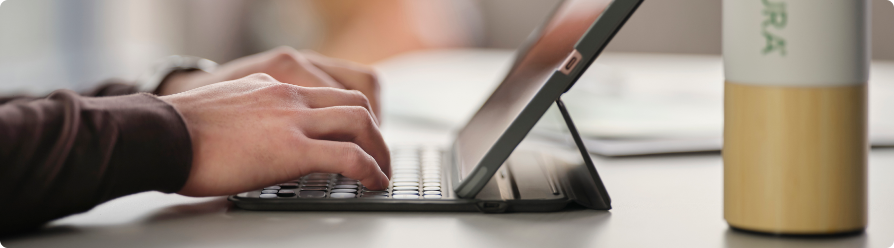 hands typing on laptop